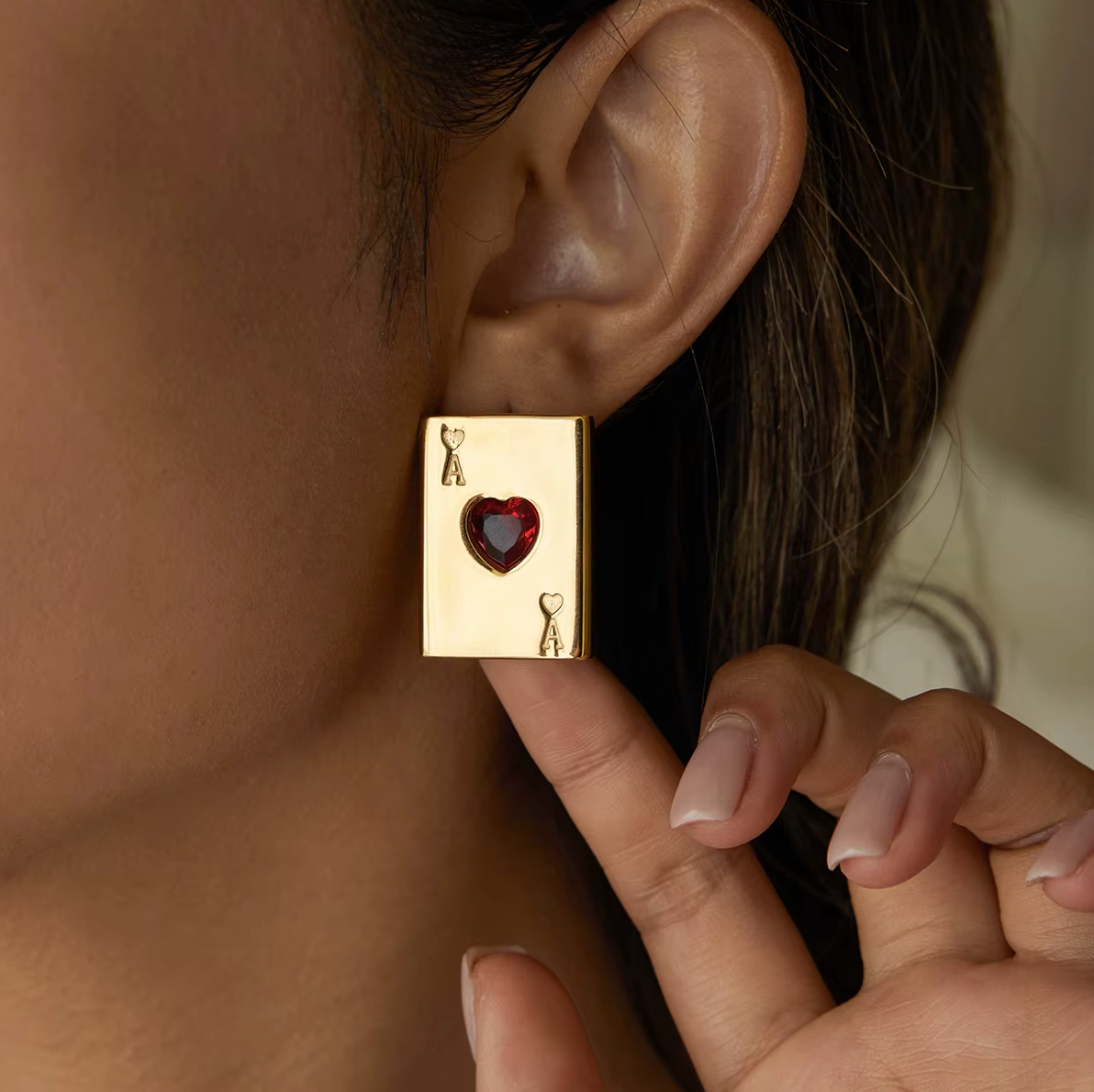Pair of gold-plated Ace of Hearts stud earrings with rectangular card design and red heart-shaped gemstones