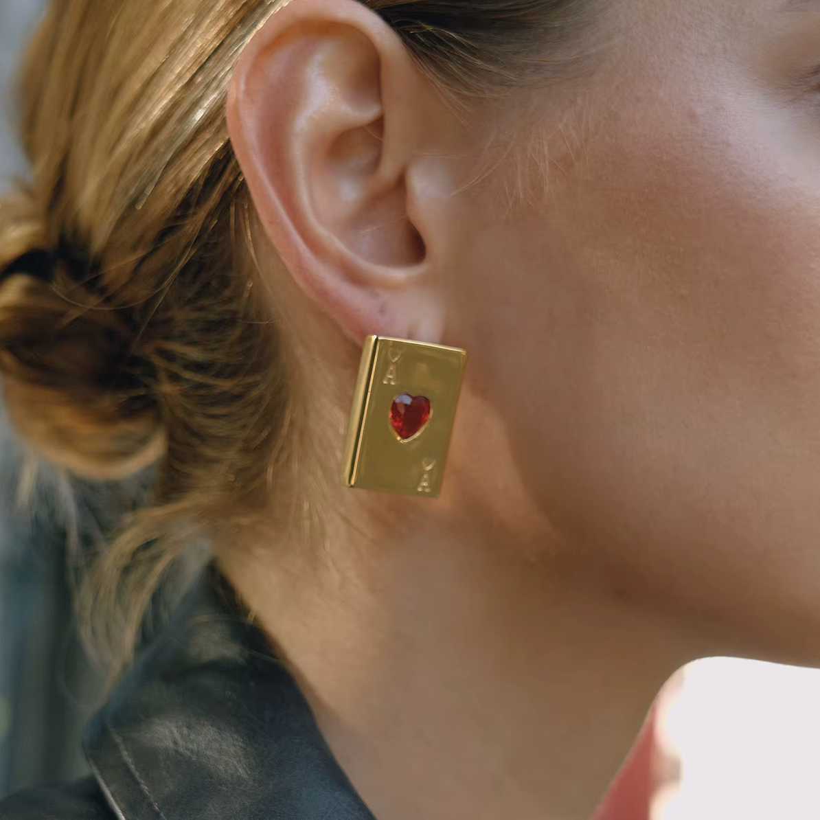 Pair of gold-plated Ace of Hearts stud earrings with rectangular card design and red heart-shaped gemstones