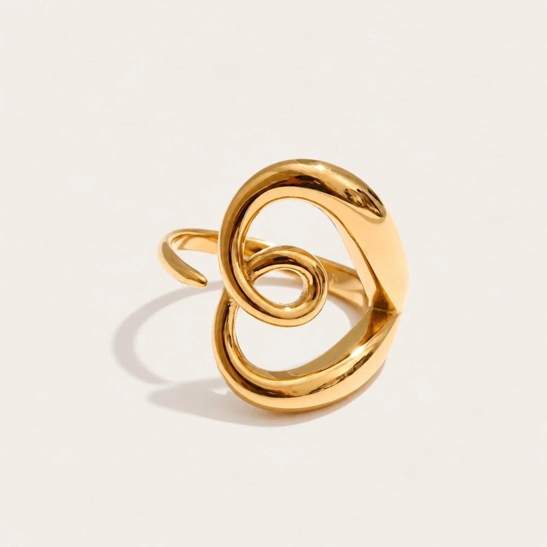Gold Amore RING: a rounded open band that twists and curls into a heart outline — Folie à Trois