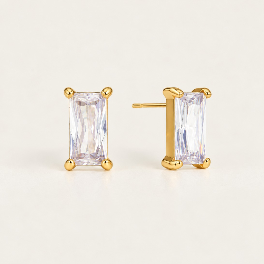 Gold Bagatelle EARRINGS: emerald-cut baguette zirconia studs in a four-prong gold setting — Folie à Trois