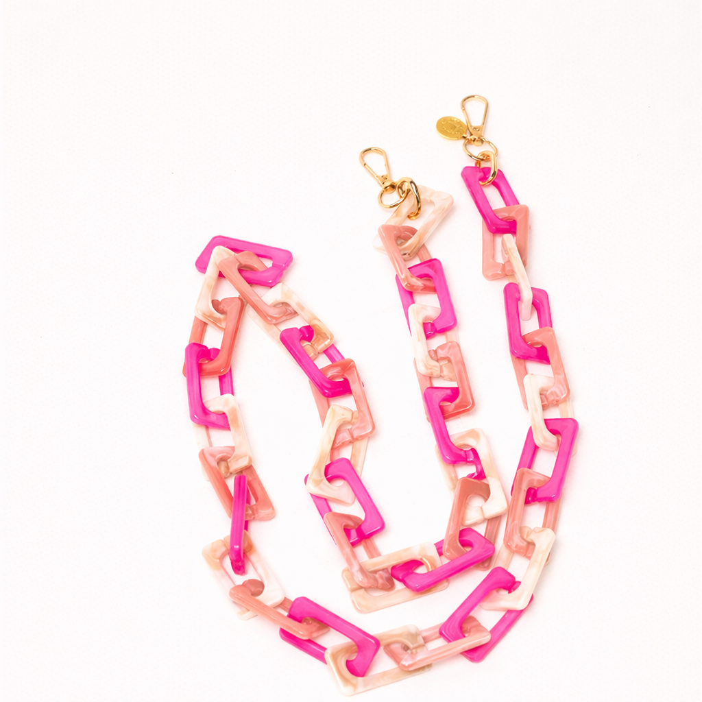Pink, magenta, and tan acrylic chain-link Bennie long phone chain coiled flat with gold clasps.