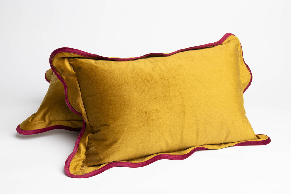 Two mustard-gold Billie Rectangle Velvet cushions with scalloped burgundy velvet edges styled together on a white background.