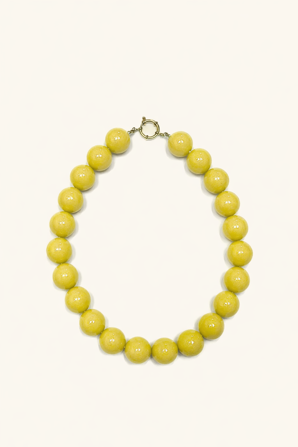 The Blaire NECKLACE in chartreuse, a single strand of large glossy round beads with a gold ring clasp, shown flat.