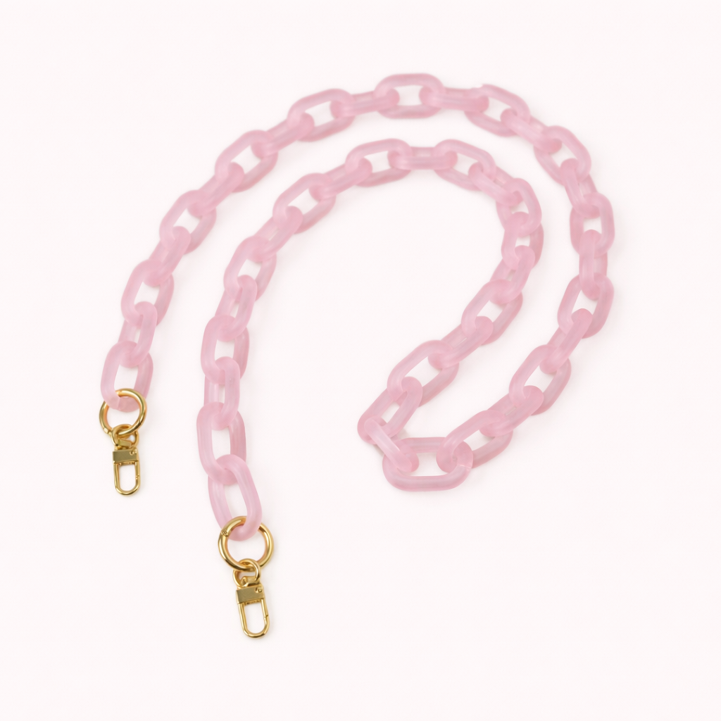 Soft pink frosted acrylic Bubble Links phone chain coiled flat with gold-tone clasp hardware.