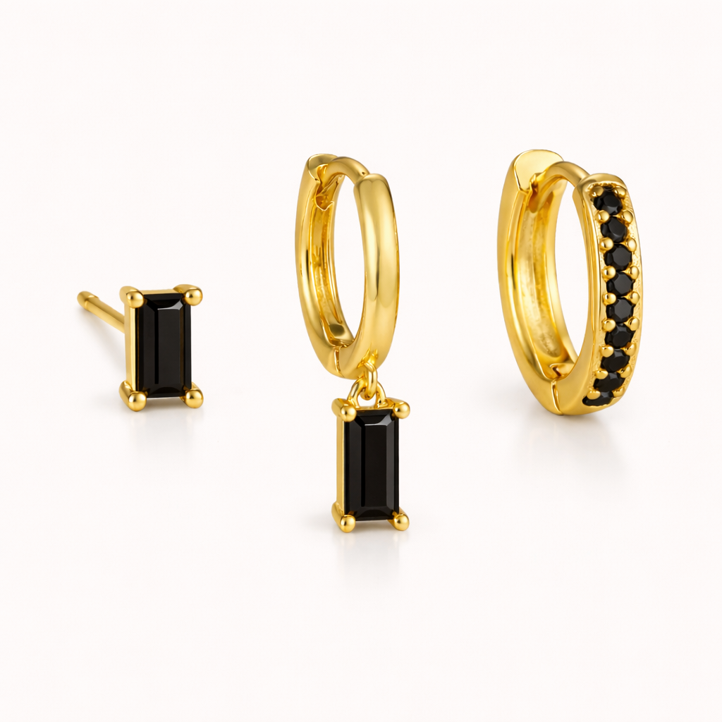 The Classic Drop SET in a black onyx colorway, featuring a baguette stud, dangle hoop, and pavé hoop in a studio shot.