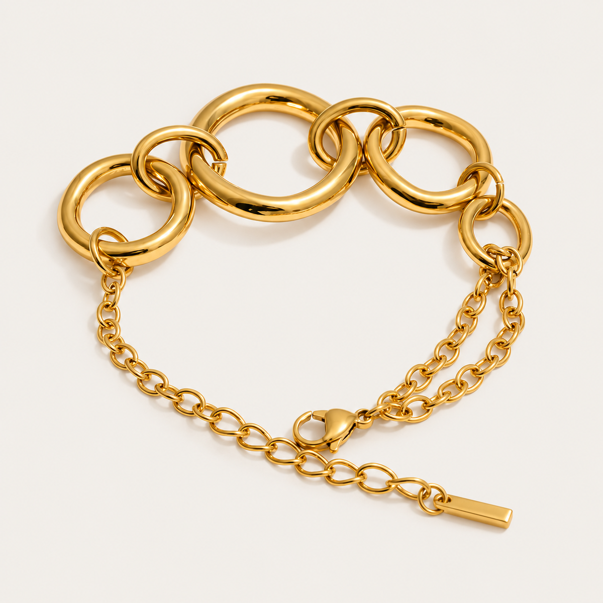 Gold chunky circular-link bracelet with an adjustable chain extender, product shot for the Folie à Trois Cluster BRACELET.