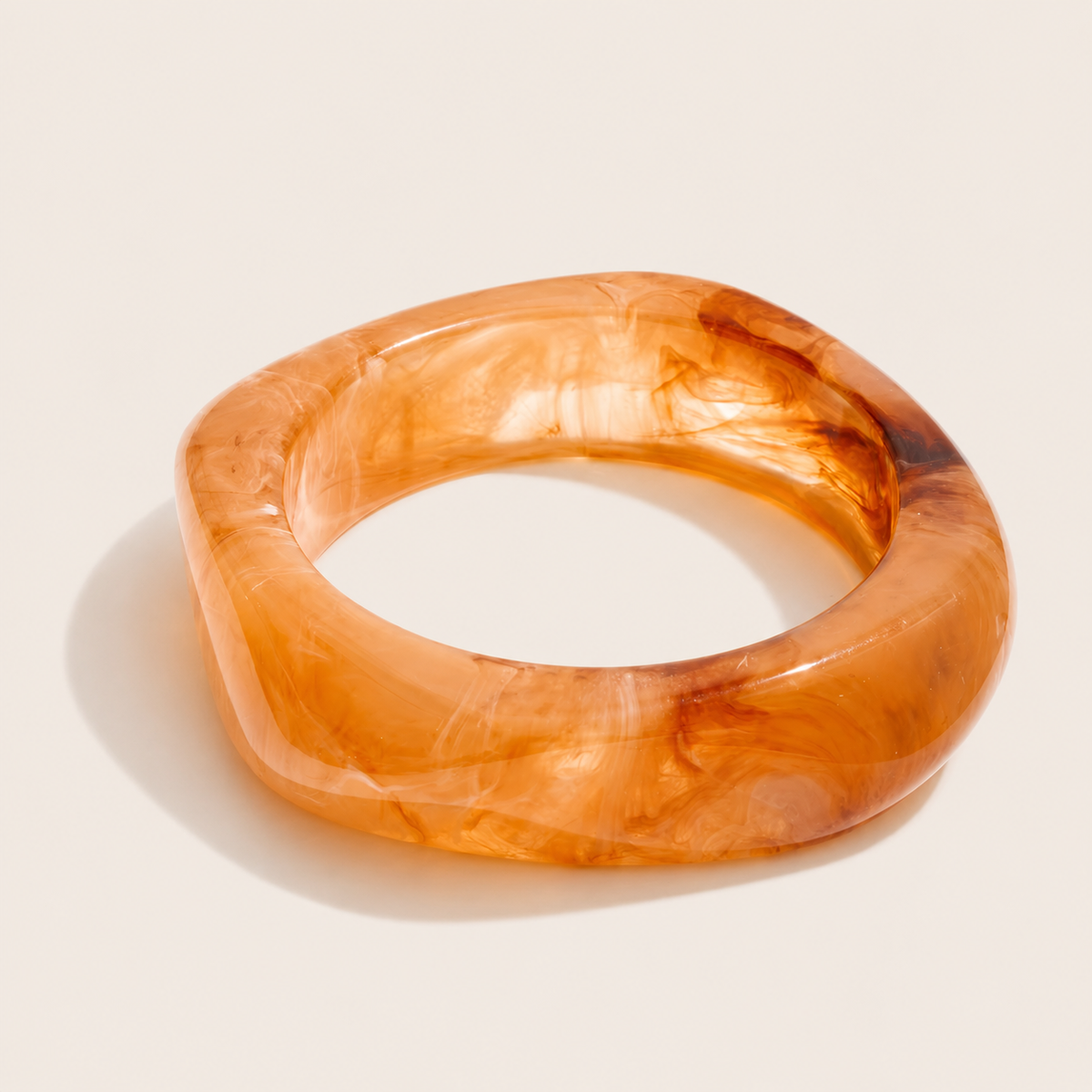 Coastal Escape BRACELET in caramel brown marbled resin, a chunky angular bangle shown on a cream background.