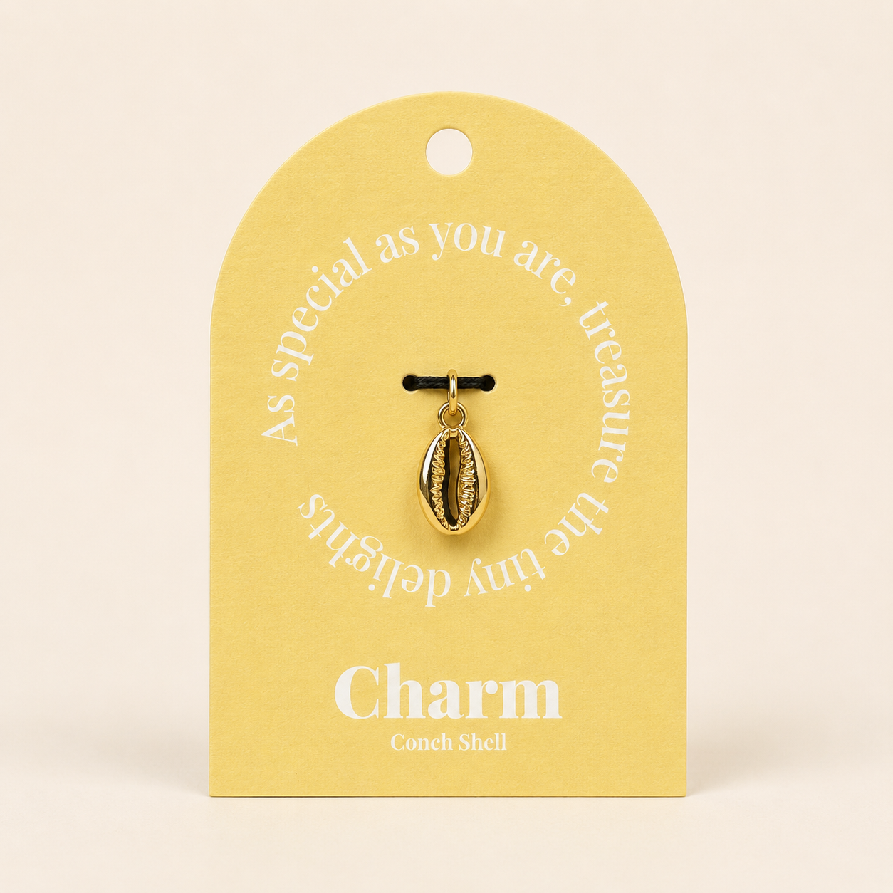 The Conch Shell CHARM displayed on a yellow Charm gift tag, hanging from a black cord against the card text As special as you are.