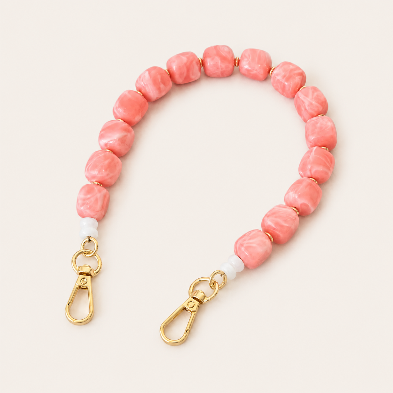 Coral pink marbled beaded phone chain with cube beads and gold clasps — Folie à Trois Cora wholesale phone accessory