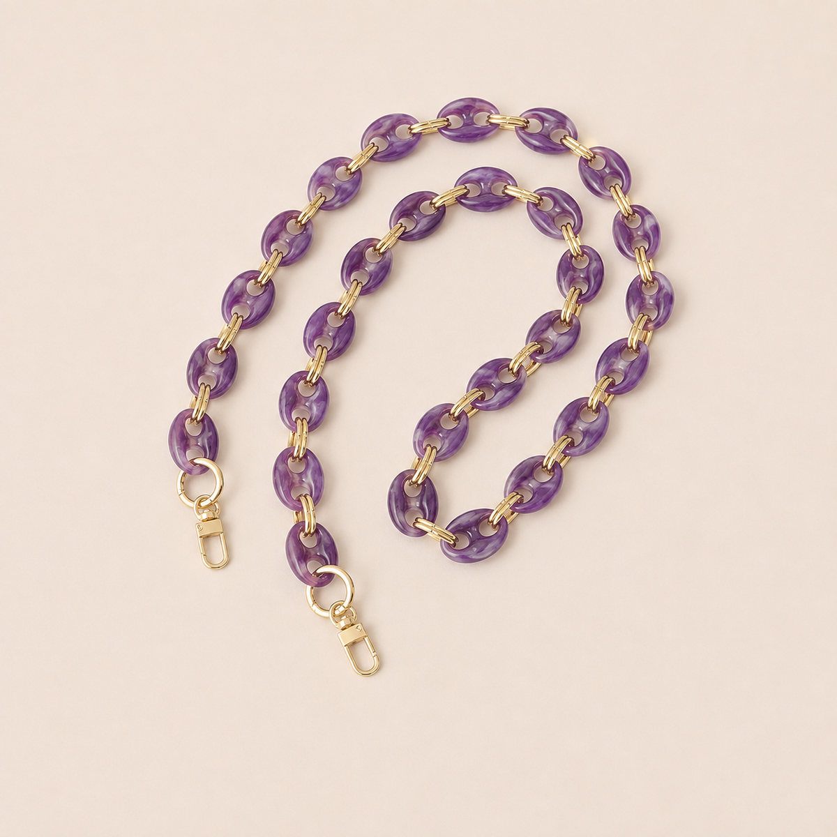 Amethyst purple marbled coin-link phone chain with gold connectors coiled on cream — Folie à Trois Corvin long phone chain