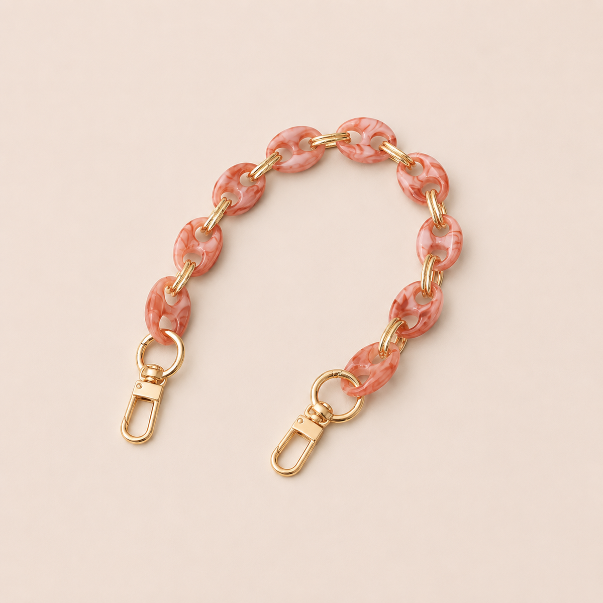 Round pink marbled coin-link phone chain with gold connectors on cream — Folie à Trois Corvin short phone chain