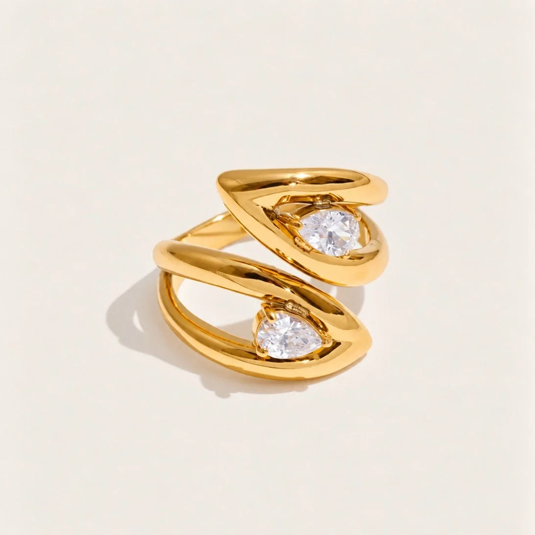 Gold Croisé RING: two overlapping bands crossing around an oval white zirconia stone — Folie à Trois