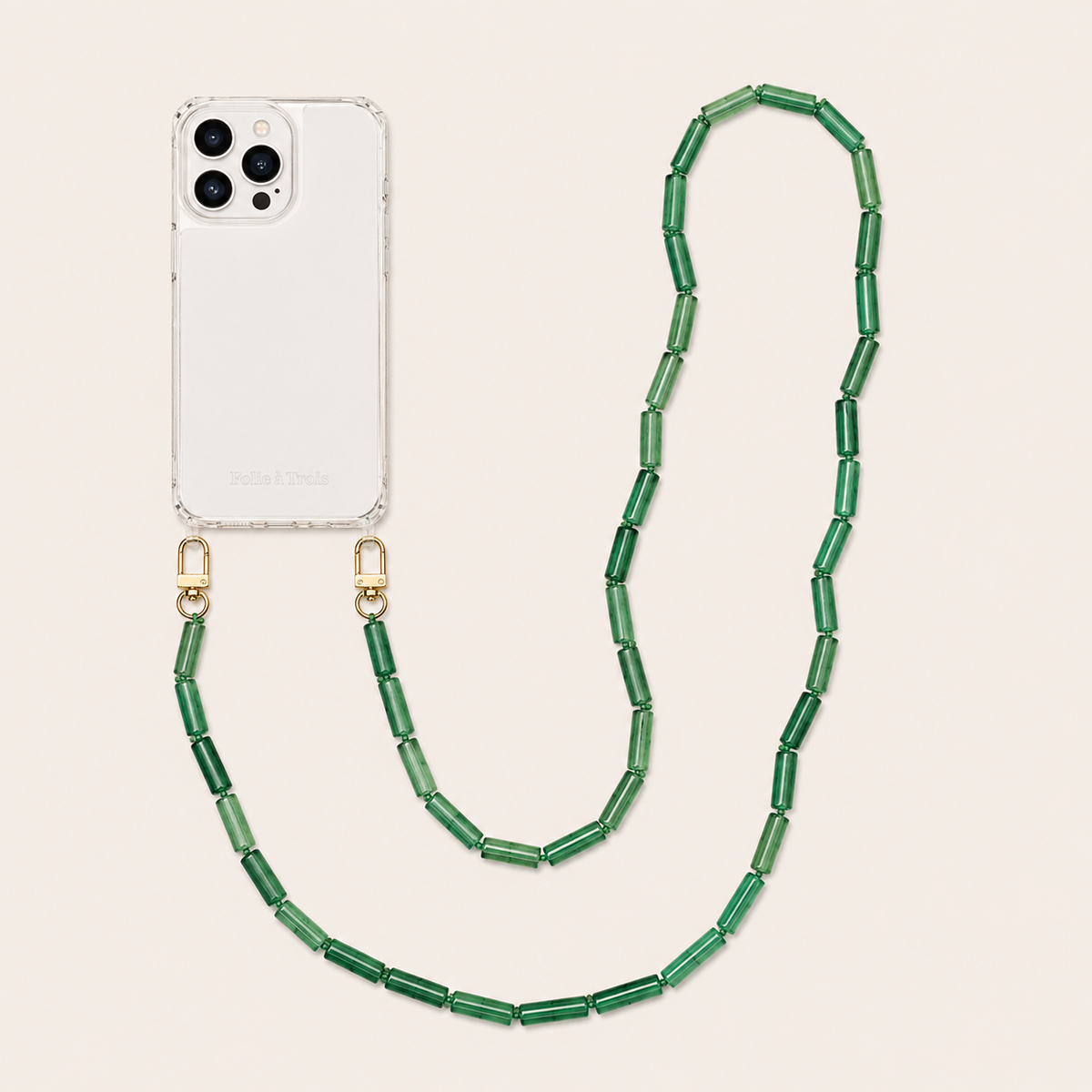 Olive green tube-bead phone chain clipped to a clear iPhone case on a cream background — Folie à Trois Elowen wholesale phone chain