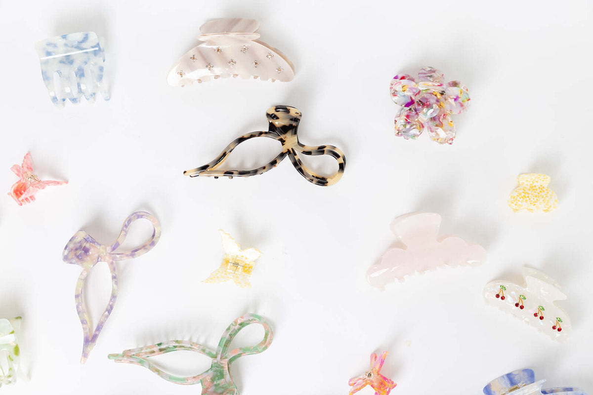 Enchanted Garden HAIR CLIP shown packed into a gift box alongside an assortment of other differently shaped hair clips.