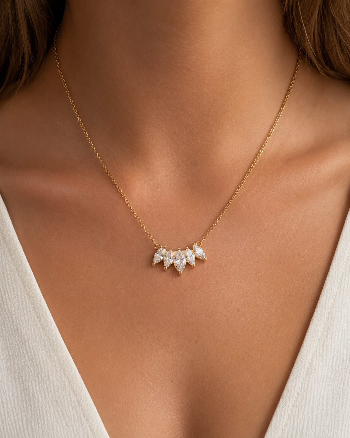 Gold Facet NECKLACE with marquise zirconia pendant worn close on the neckline over a white top — Folie à Trois
