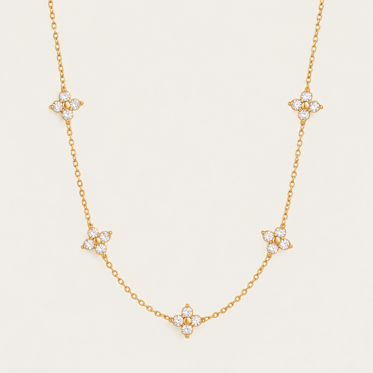 Gold Fiore NECKLACE: delicate chain with five sparkling zirconia flower stations — Folie à Trois