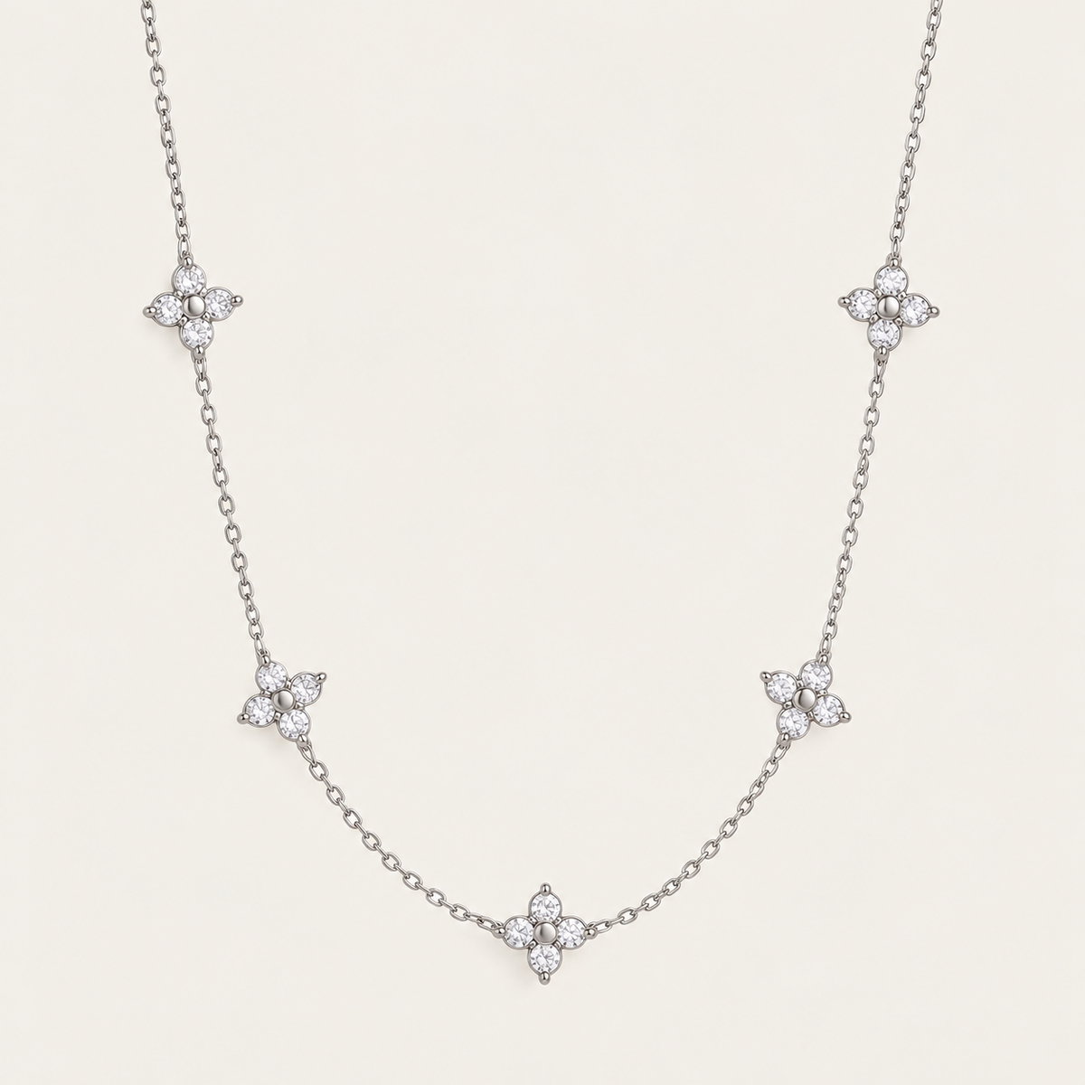 Silver-tone Fiore NECKLACE: delicate chain with five sparkling zirconia flower stations — Folie à Trois