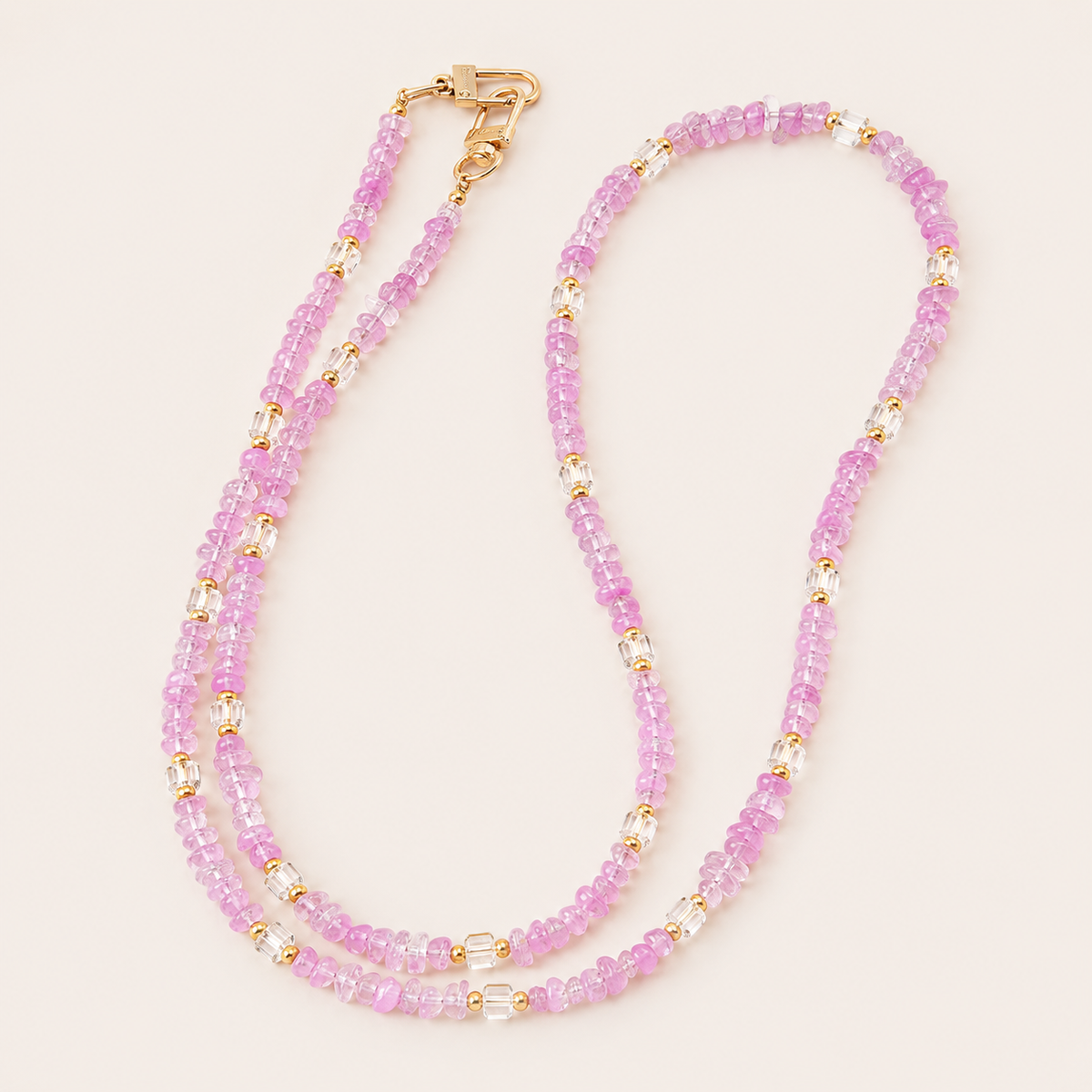 Double-strand lilac and faceted clear bead phone chain with gold accents on cream — Folie à Trois Hollis long phone chain