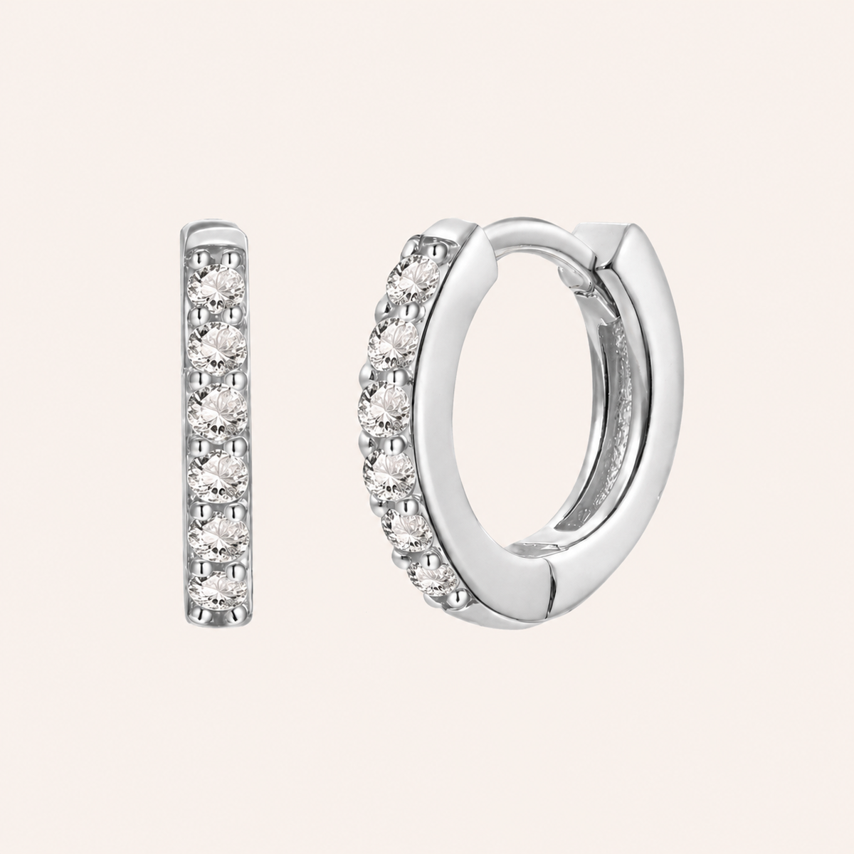 In a Dream Earrings in silver with clear crystals, the huggie hoop set with six round graduated stones.