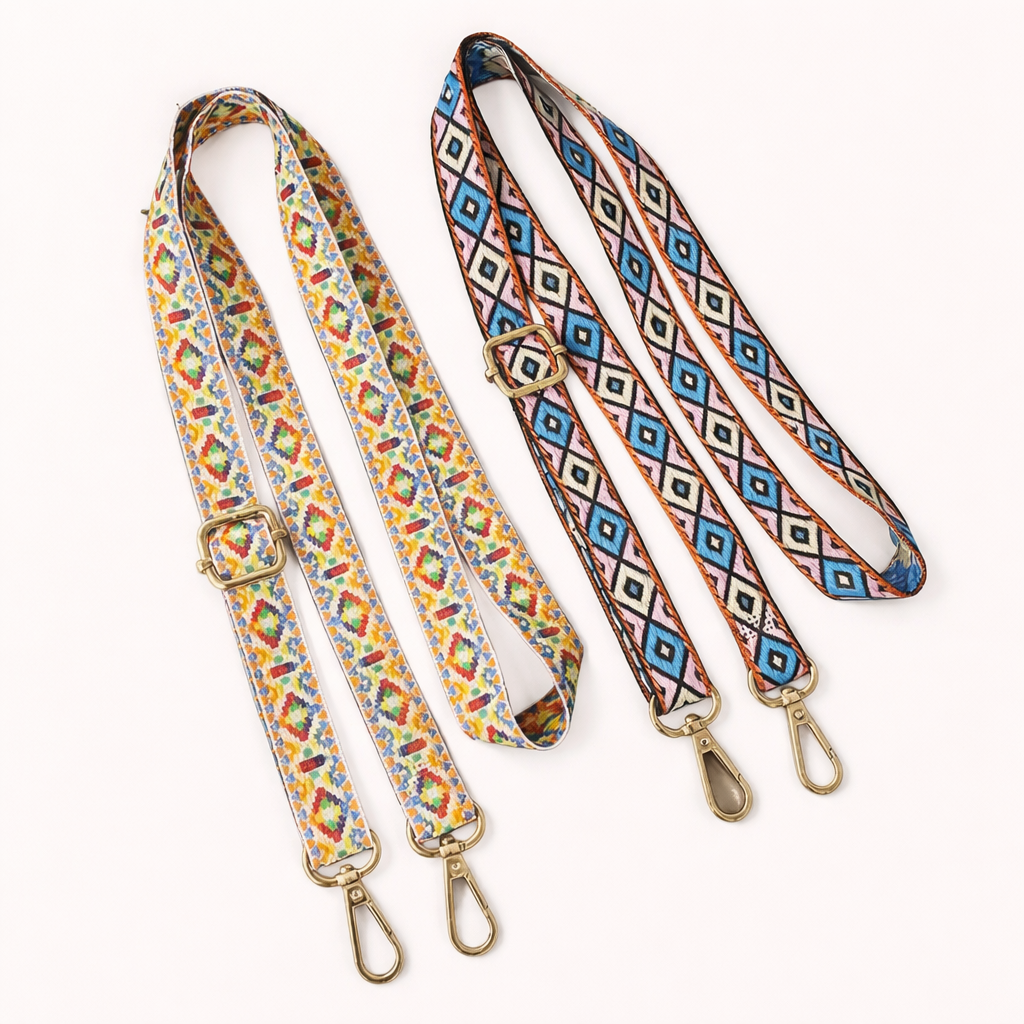 Two Jetlag long phone strap colorways shown together: a multicolor print and a blue-and-pink Aztec pattern.