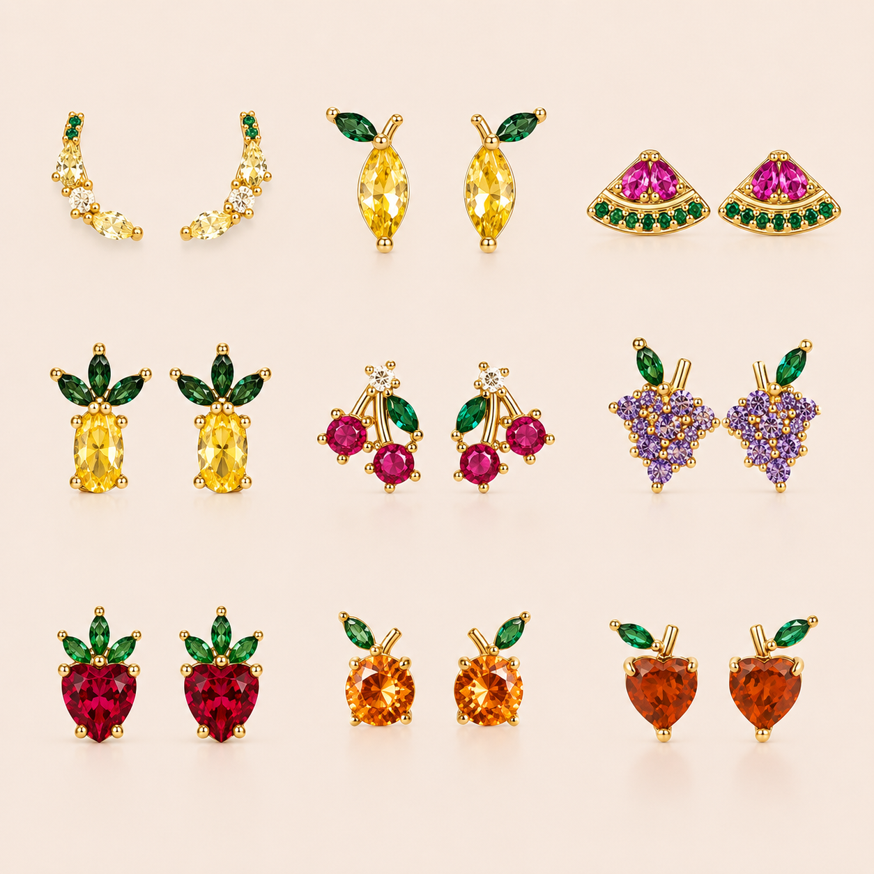 Grid of gold fruit-themed stud earrings from the Little Fruit EARRINGS in nine designs, including cherry, grape, strawberry, and pineapple.