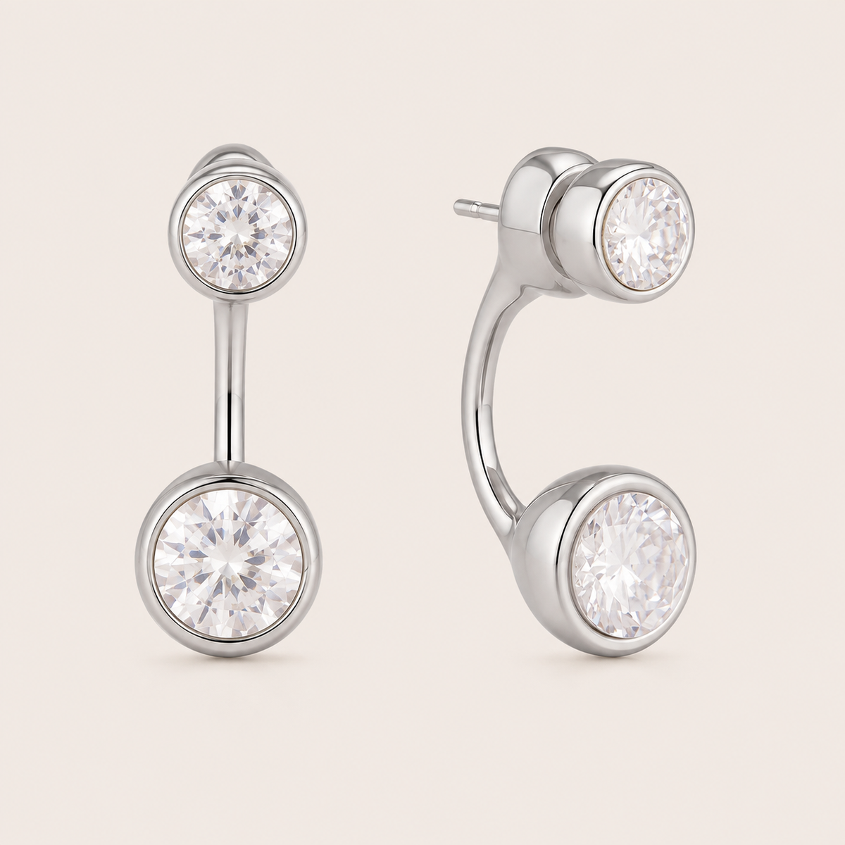 Silver ear-jacket stud earring with two round bezel-set white zirconia stones linked by a slender bar — Folie à Trois Ondine EARRINGS.