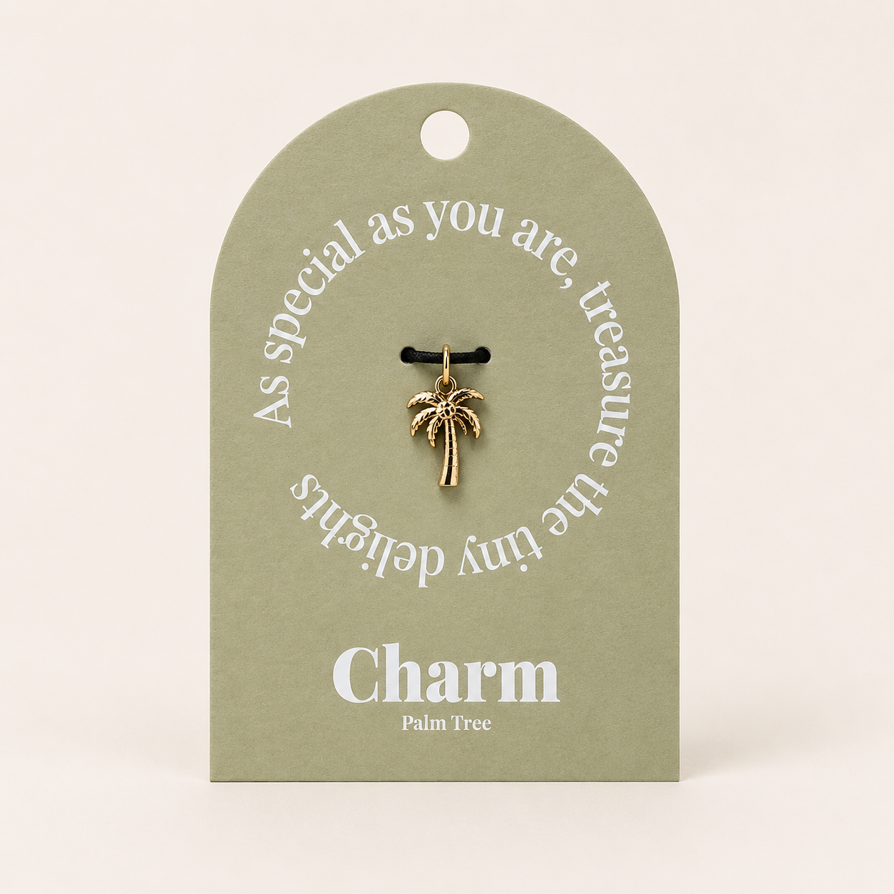 The Palm Tree CHARM displayed on a sage green Charm gift tag, hanging from a black cord against the card's text.