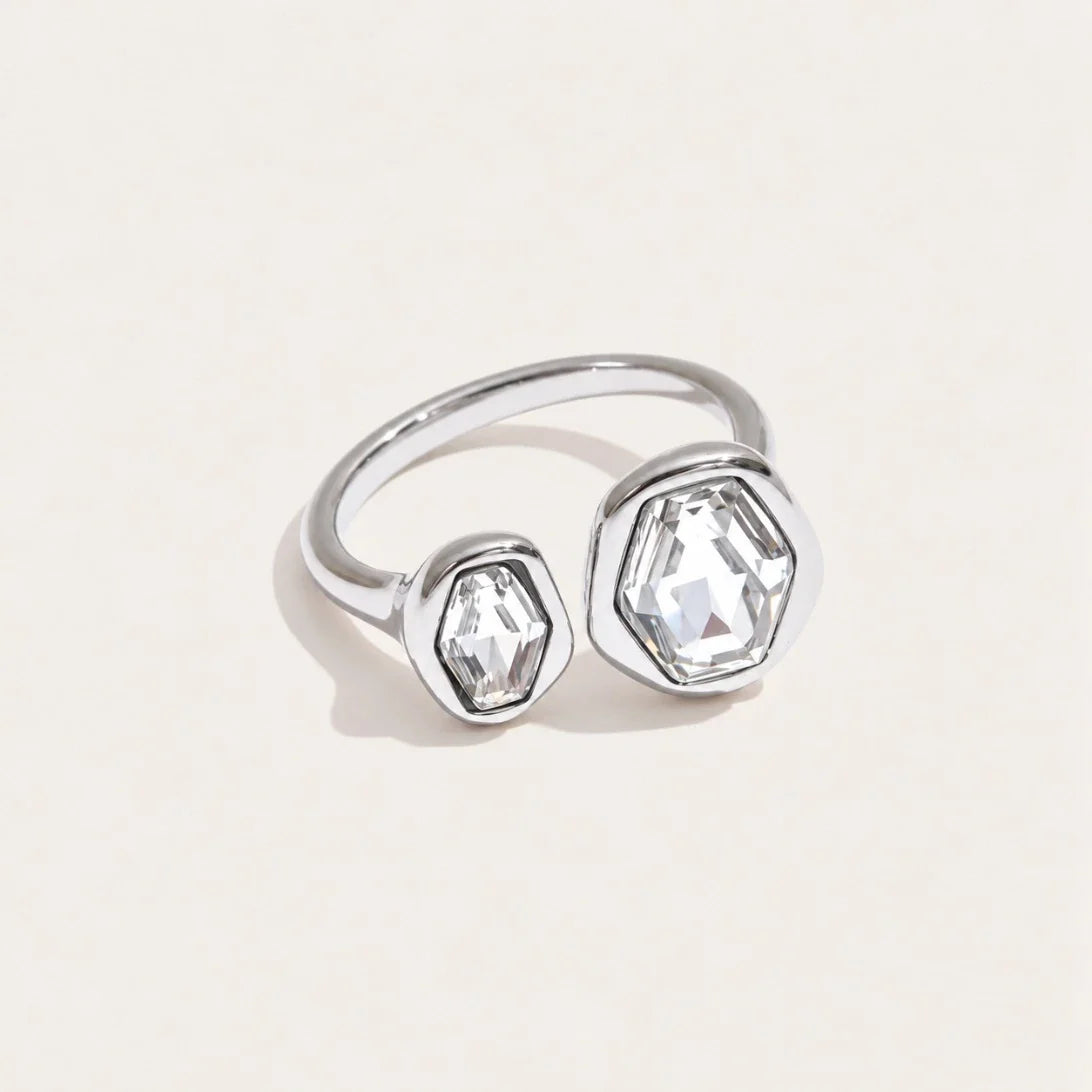 Silver-tone Roche RING: an irregular, sculpted open band wrapped around a round white zirconia — Folie à Trois