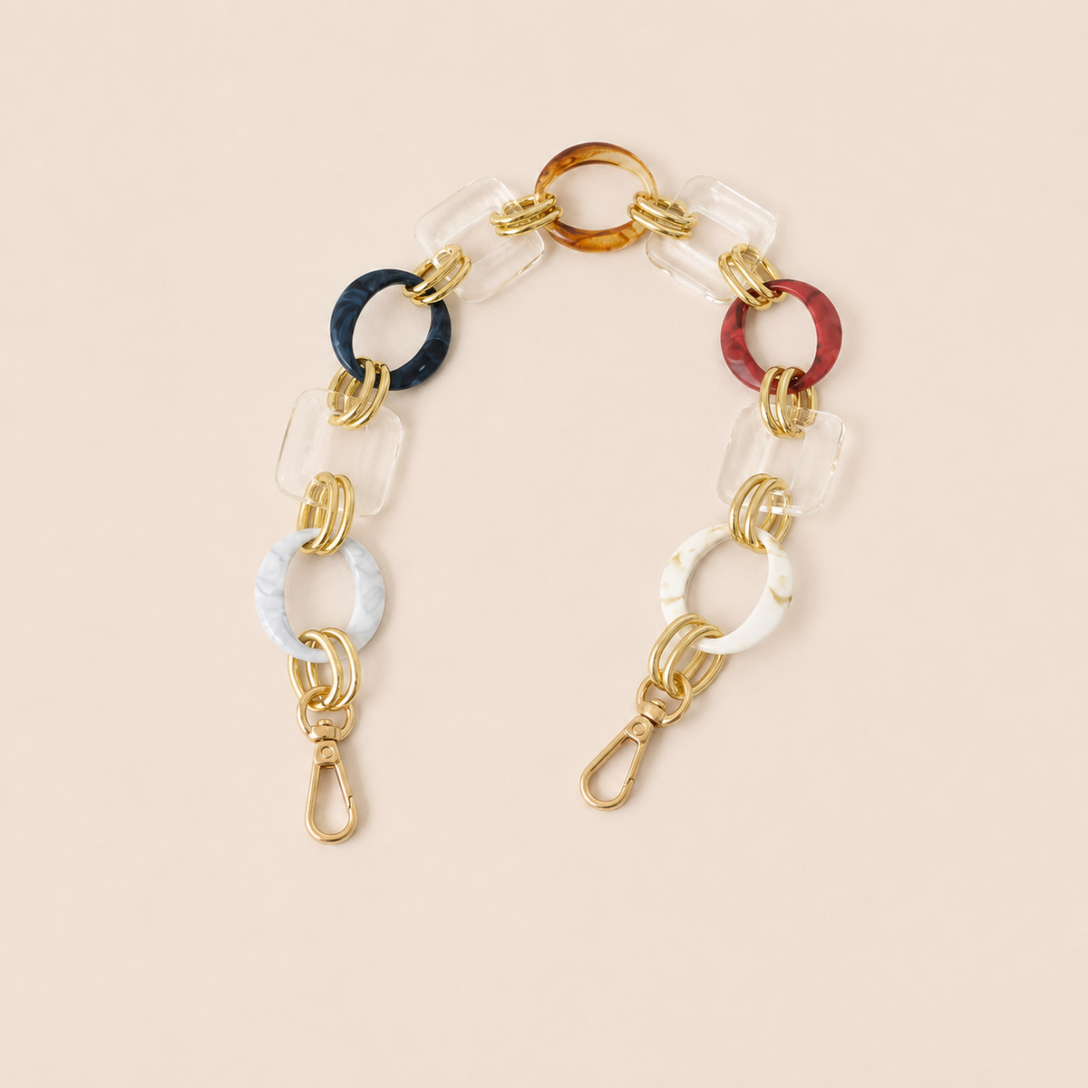 Short multicolour acrylic ring-link phone chain in navy, rust, white and clear with gold connectors — Folie à Trois Rowan short phone chain
