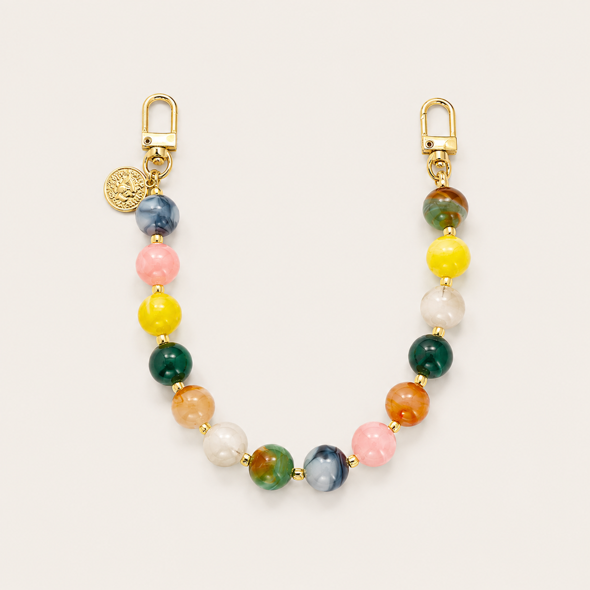 The Sable PHONE CHAIN in mixed multicolor beads of blue, pink, yellow, green, and orange with gold-tone clasps and a coin charm.