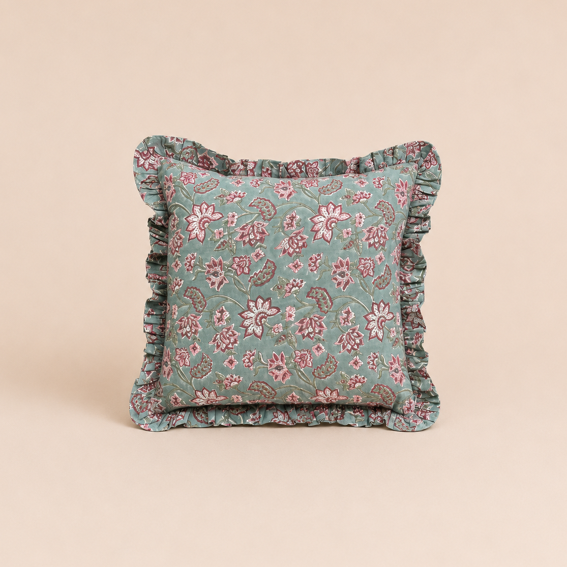 Sage green square cushion with a pink and burgundy floral vine print and ruffled trim, the Sehra Green Square Cushion on a neutral backdrop.