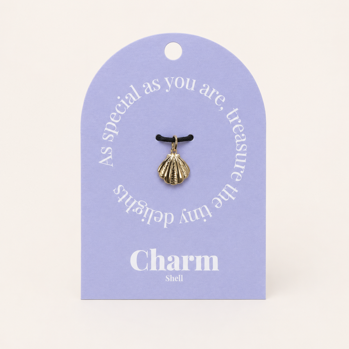 The Shell CHARM displayed on a lavender Charm gift tag, hanging from a black cord against the card text As special as you are.