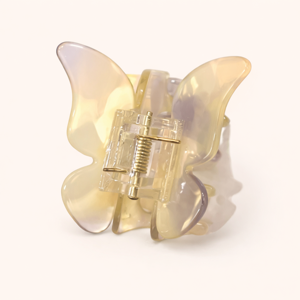 Pale yellow and lavender iridescent layered acetate butterfly-shaped claw clip from the True Paradise HAIR CLIP collection.