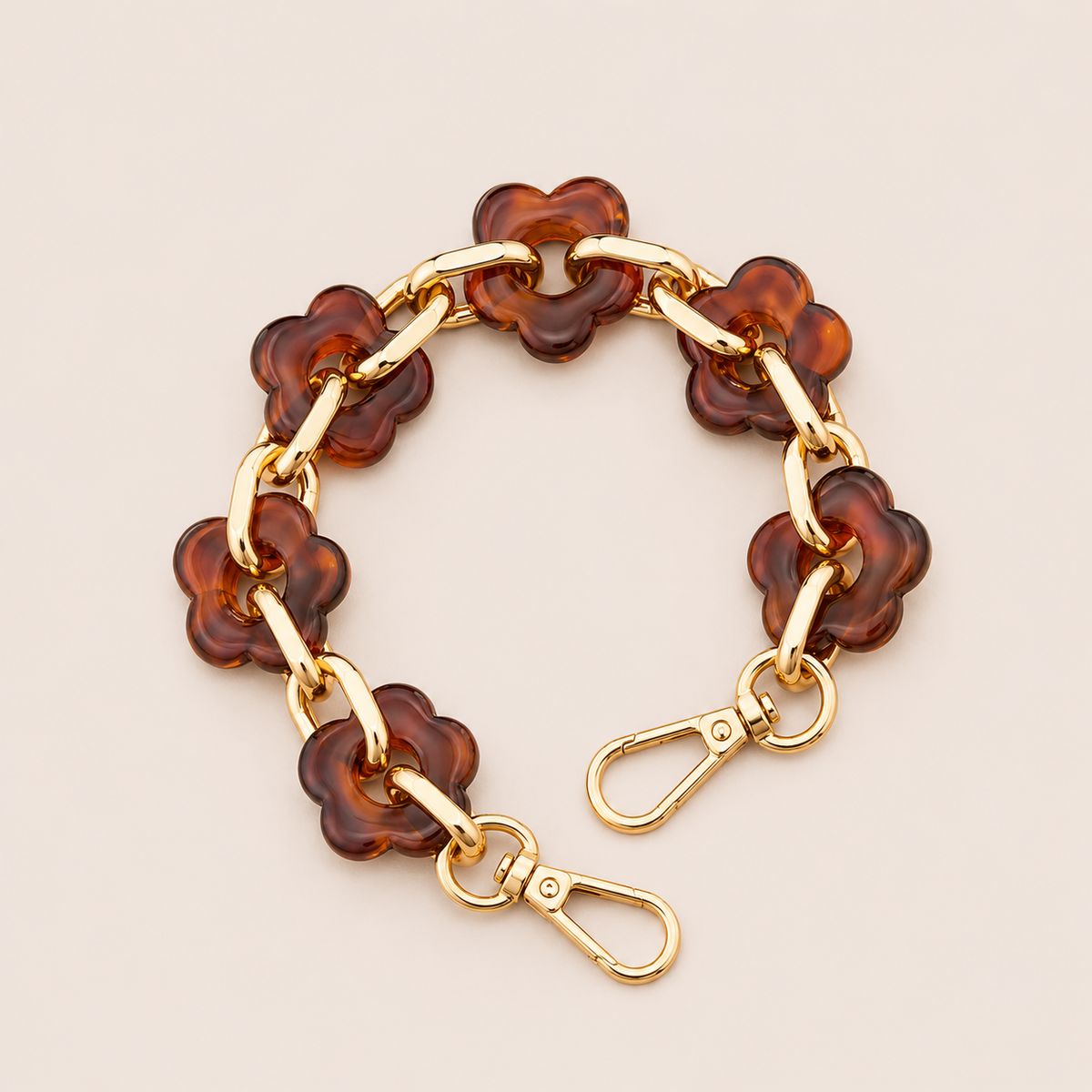 Round flower-link phone chain in amber tortoiseshell acrylic with gold chain links — Folie à Trois Zinnia short phone chain