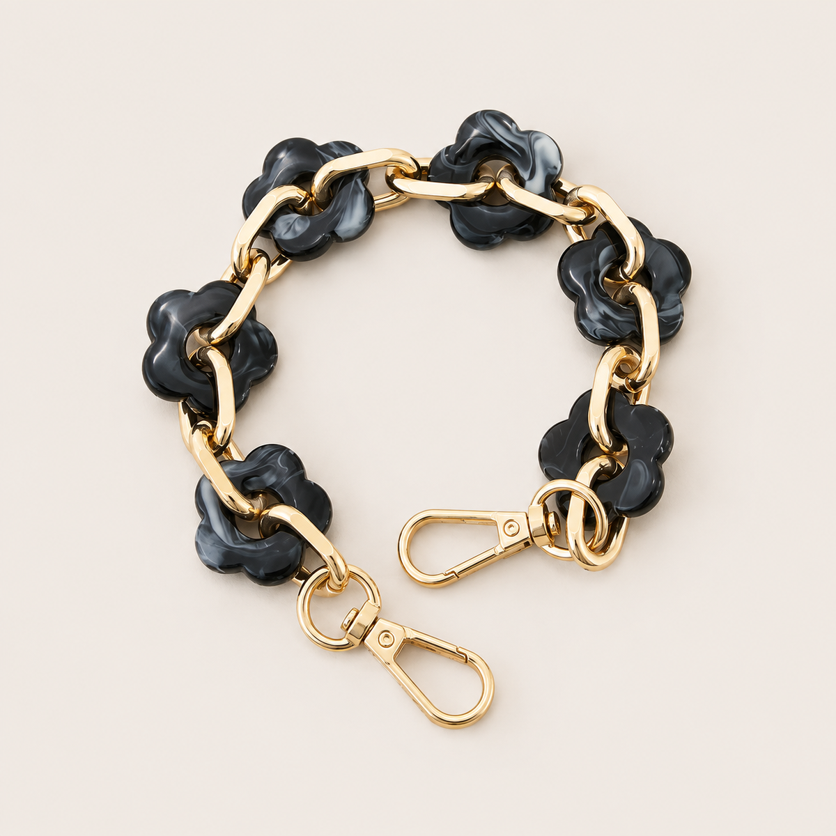 Round flower-link phone chain in charcoal marbled acrylic with gold chain links — Folie à Trois Zinnia short phone chain
