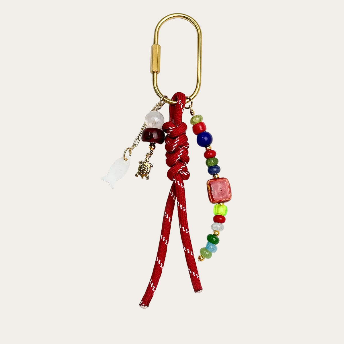Marisol BAG CHARM Red - red woven cord with colorful beads and a gold-tone turtle charm
