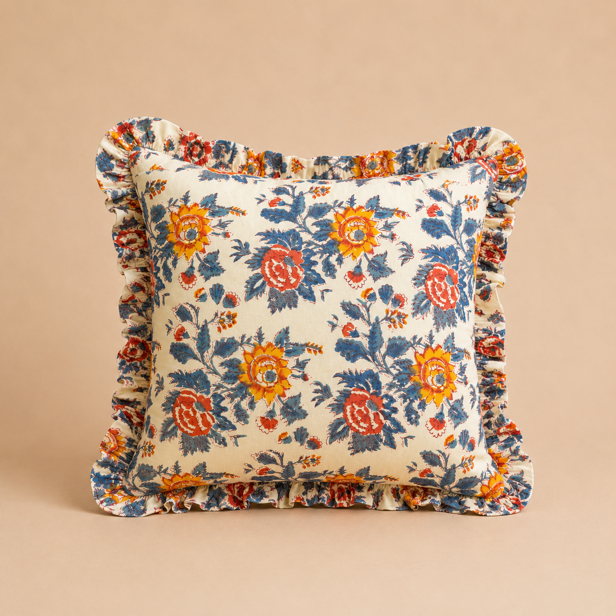 Floral patterned pillow with ruffled edges on a beige background