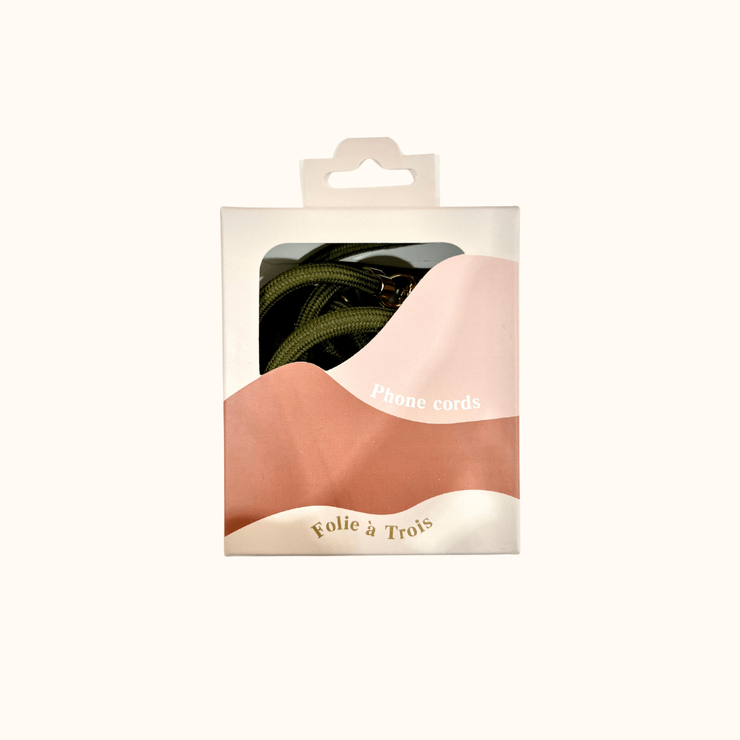 Aesthetic Colorful PHONE CORD packaging box labeled "Phone cords" by Folie à Trois with a green cord inside.