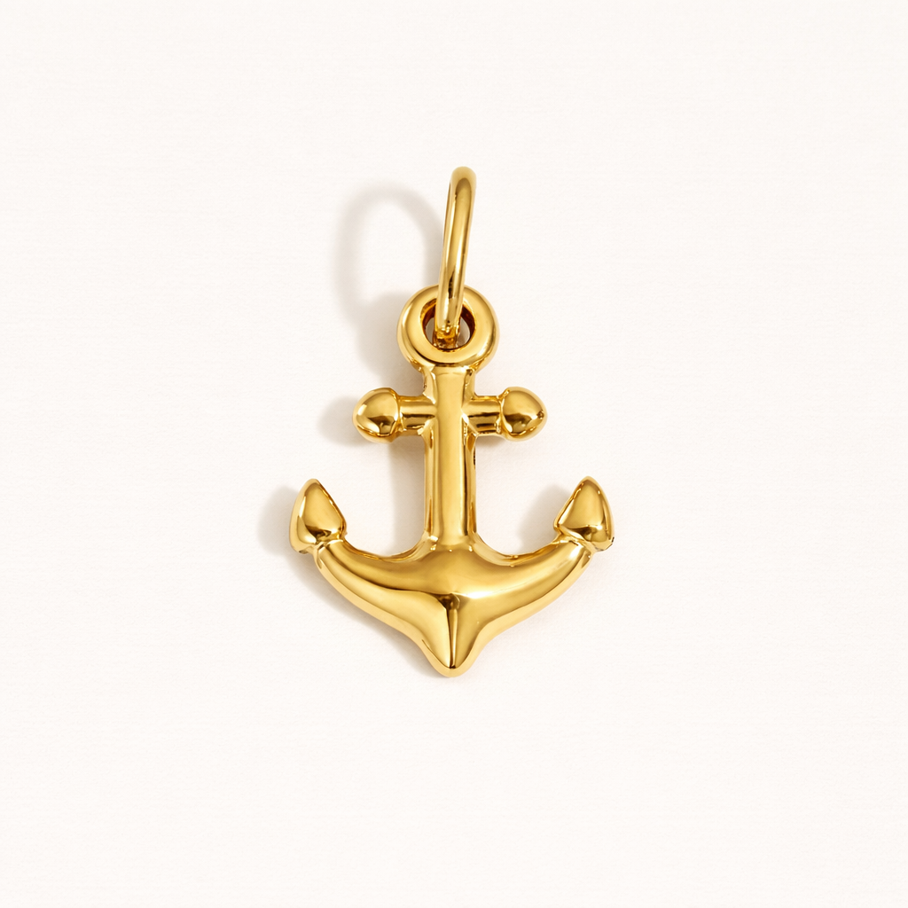 The Anchor CHARM in polished gold, its classic anchor shape shown alone on a plain white studio background.