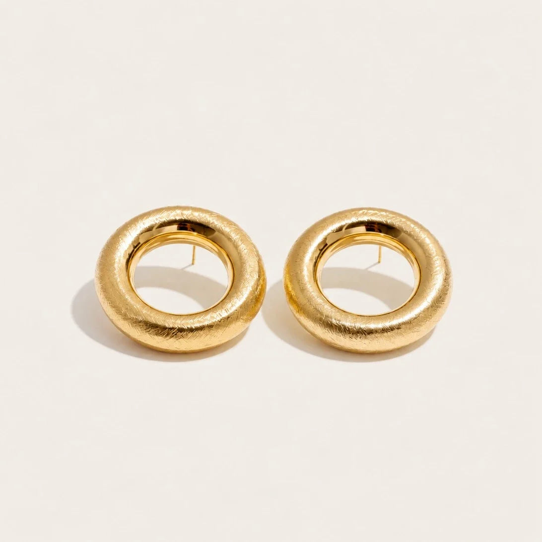 Gold Anello EARRINGS: a pair of bold, rounded ring-shaped earrings with a textured surface — Folie à Trois