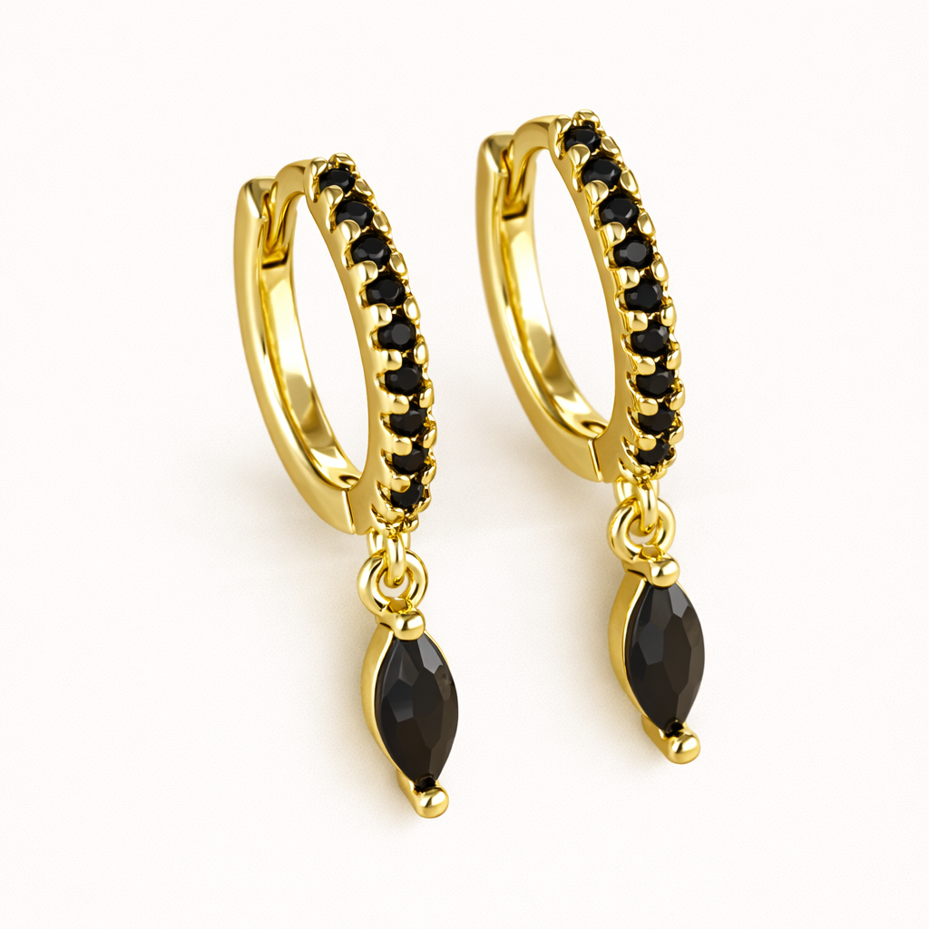 Anette Earrings in gold with black crystals, the pave huggie hoop dropping a polished marquise-cut black stone.