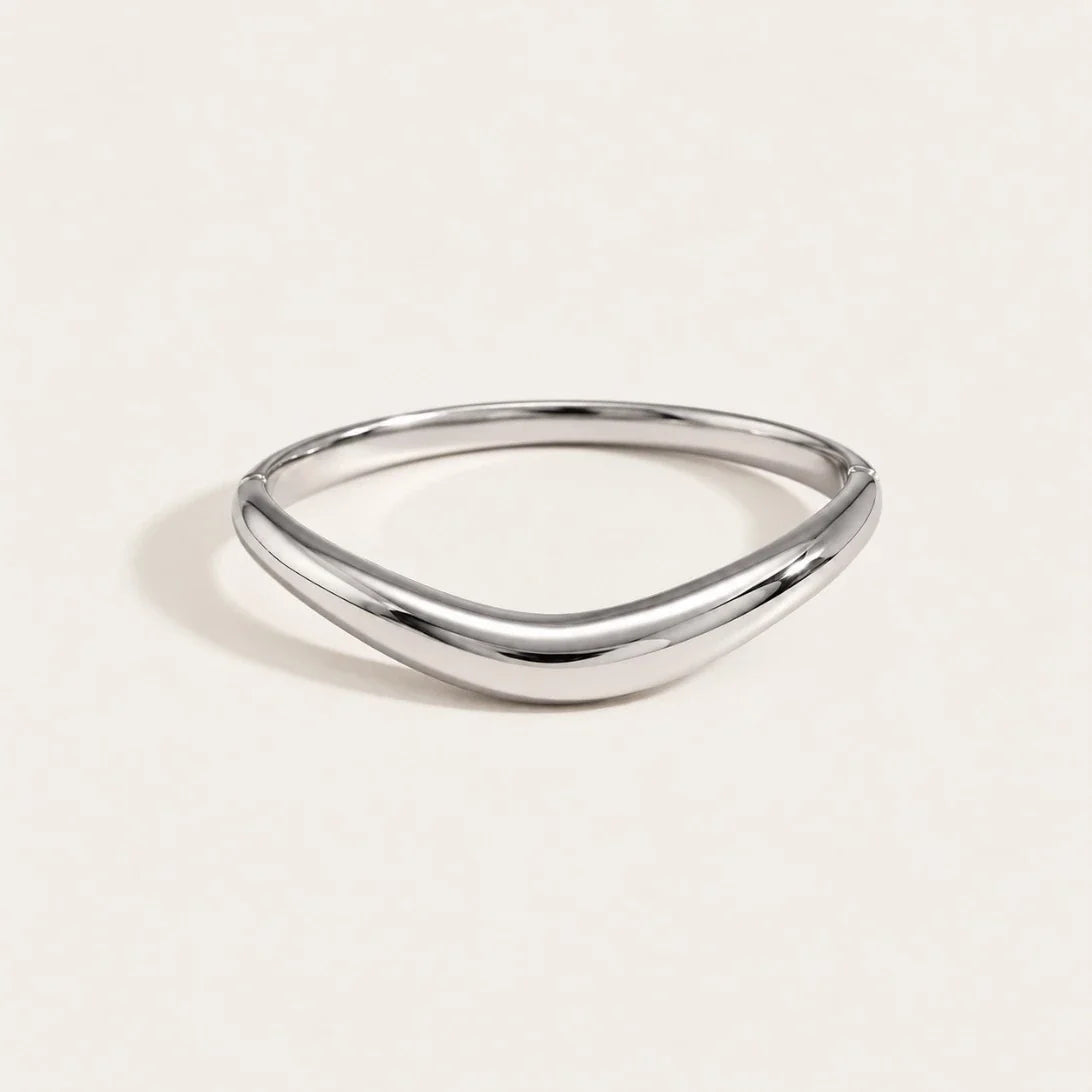 Silver-tone Arco BRACELET: a slim, polished bangle with a soft curved arch — Folie à Trois