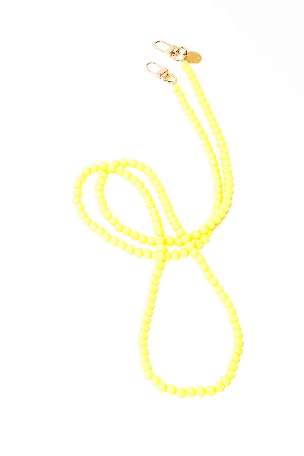 Bright yellow beaded Aurora PHONE CORD looped on a white background with gold-tone clasps.