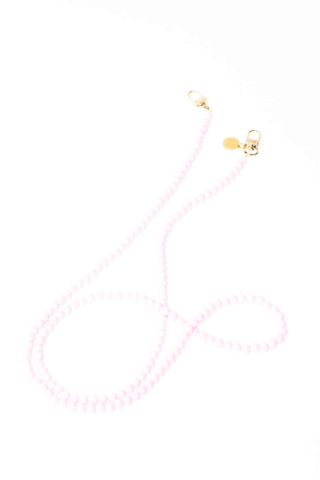 Light pink beaded Aurora PHONE CORD shown from another angle with gold-tone clasps on white.