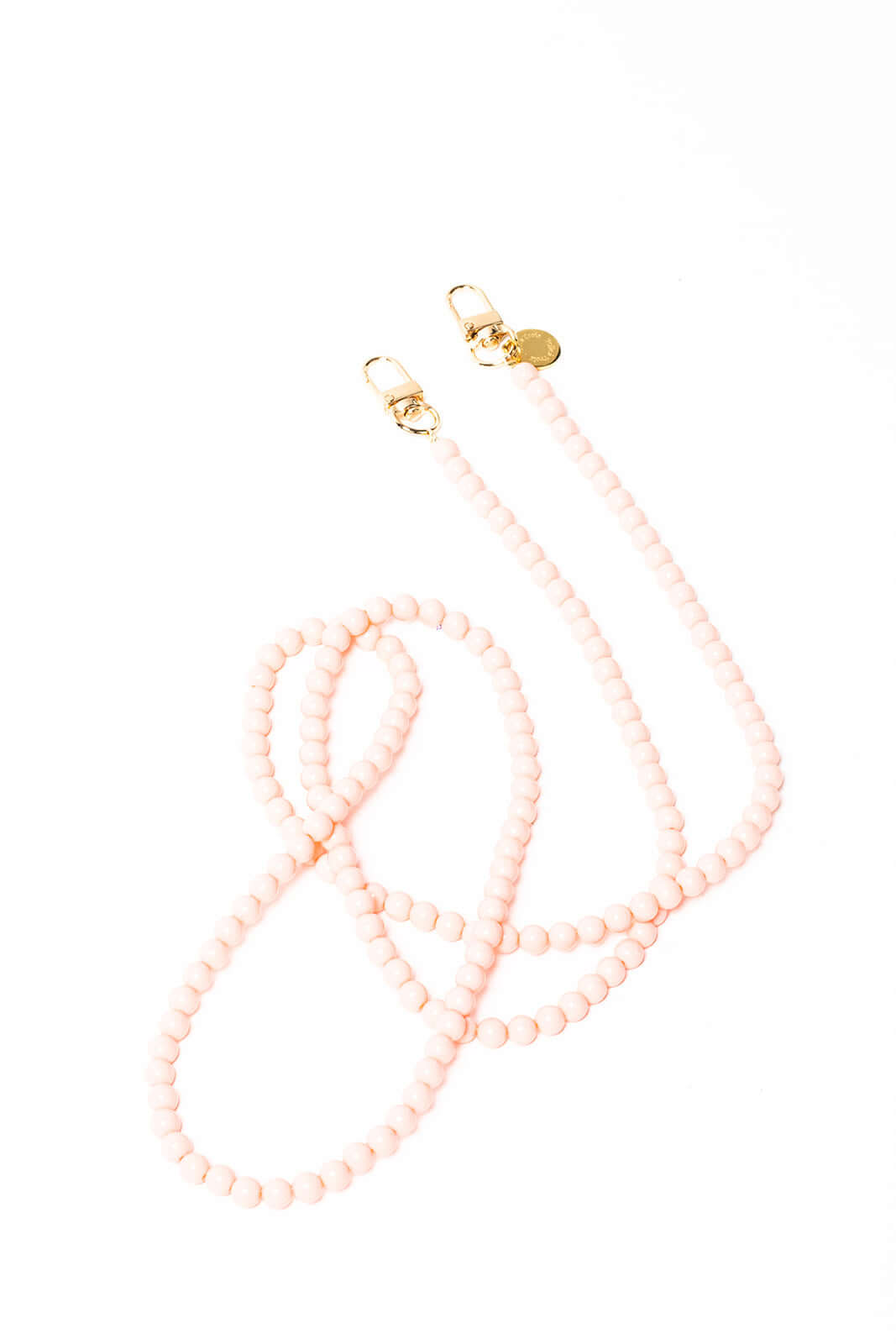 Light pink beaded Aurora PHONE CORD coiled on a white background with gold-tone clasps.