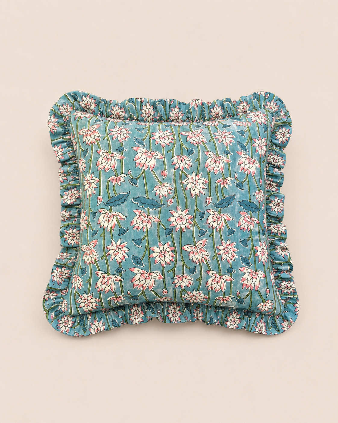 Azure Blossom Square cushion in soft blue with a hand-blocked pink and white lotus floral print, framed by a delicate ruffled edge.