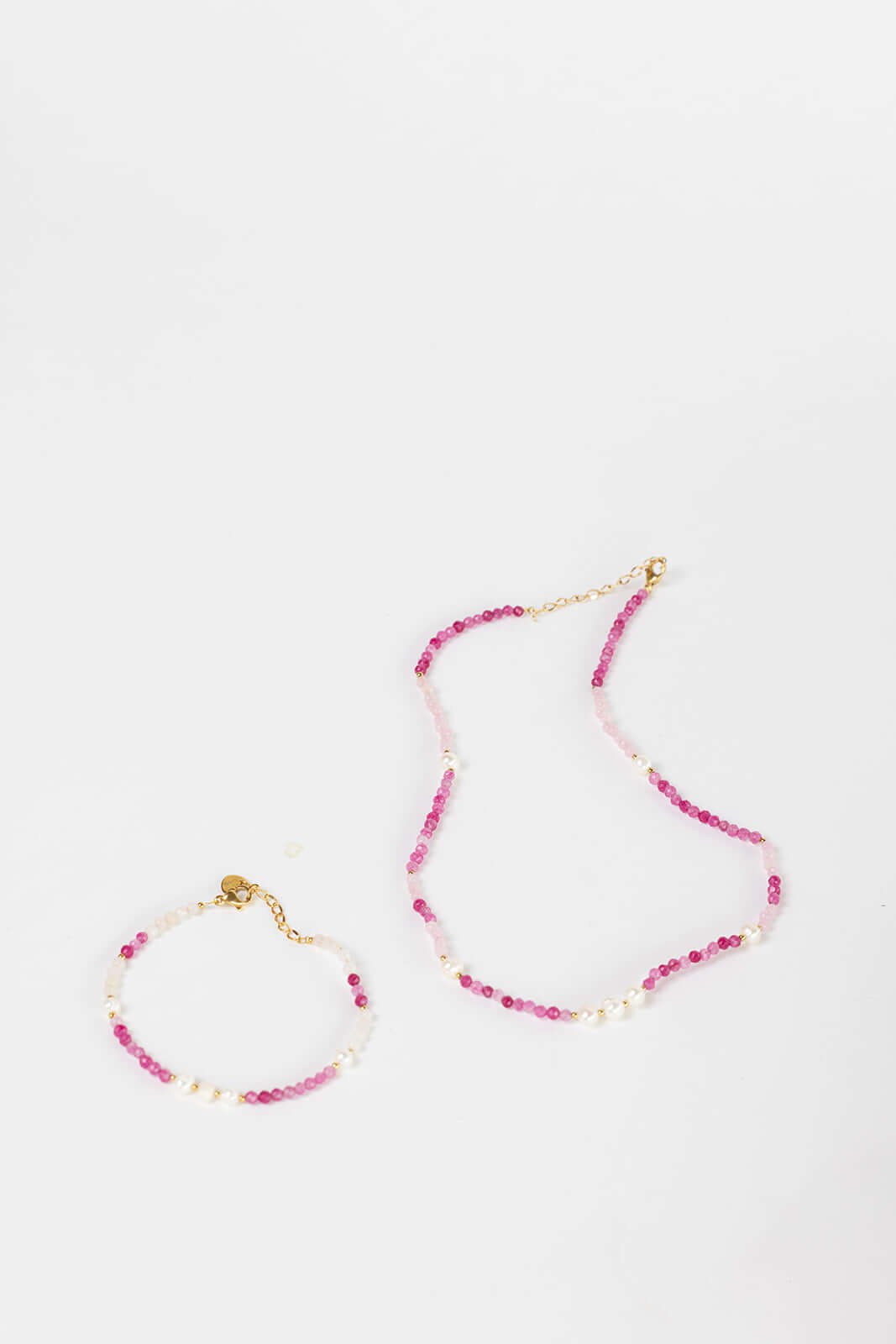 Bianca BRACELET pink and white beaded bracelet with pearl accents, shown beside the matching necklace on white.