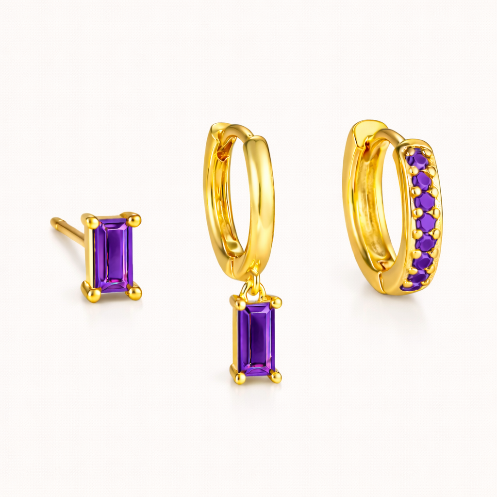 The Classic Drop SET in an amethyst purple colorway, featuring the baguette stud, dangle hoop, and pavé hoop in a studio shot.