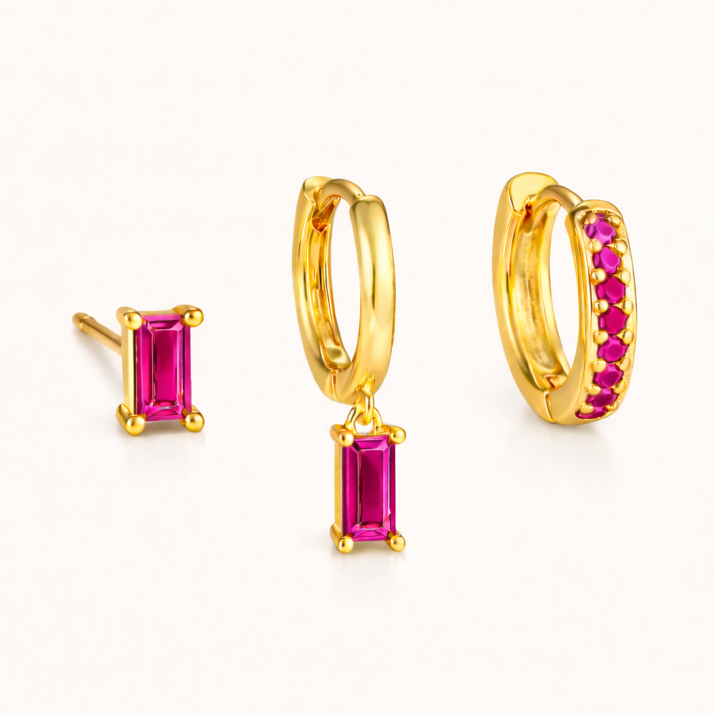 The Classic Drop SET in a fuchsia pink colorway, showing the baguette stud, dangle hoop, and pavé hoop together in studio.
