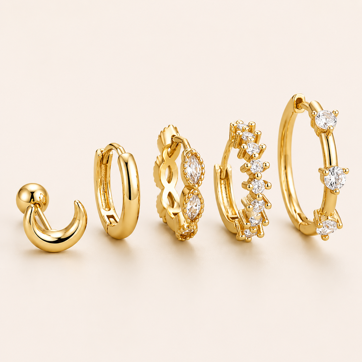 Five-piece Claudia SET gold earrings: a moon stud, plain hoop, infinity marquise hoop, zigzag pave hoop, and hoop with round stones.